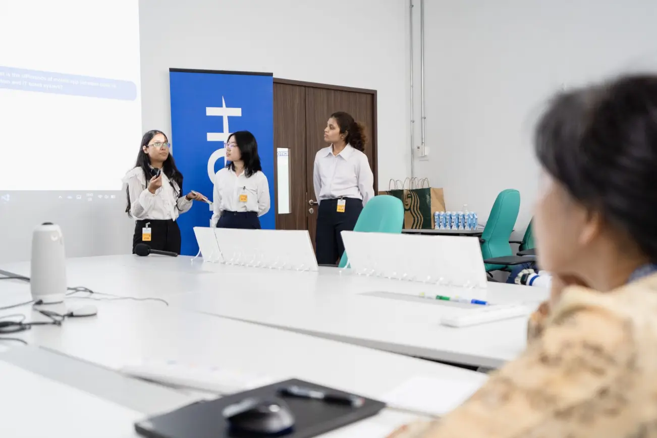 HOYA Electronics employees collaborating in the workplace